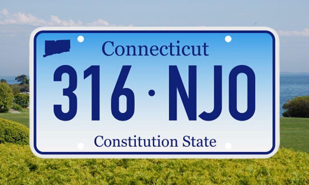 Standard Connecticut license plate on a lush green backdrop.