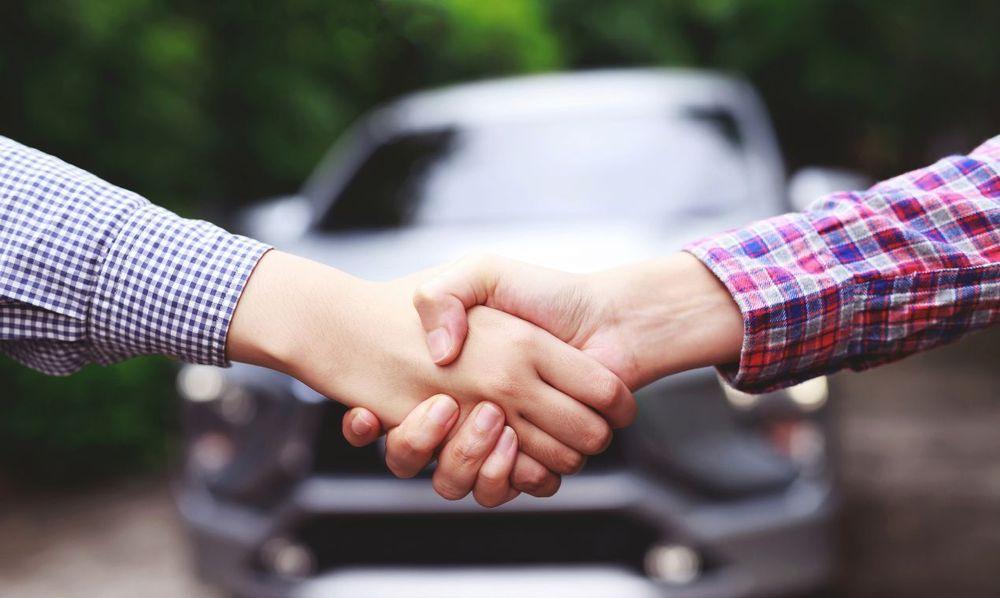 Businessmen are buying/selling used cars