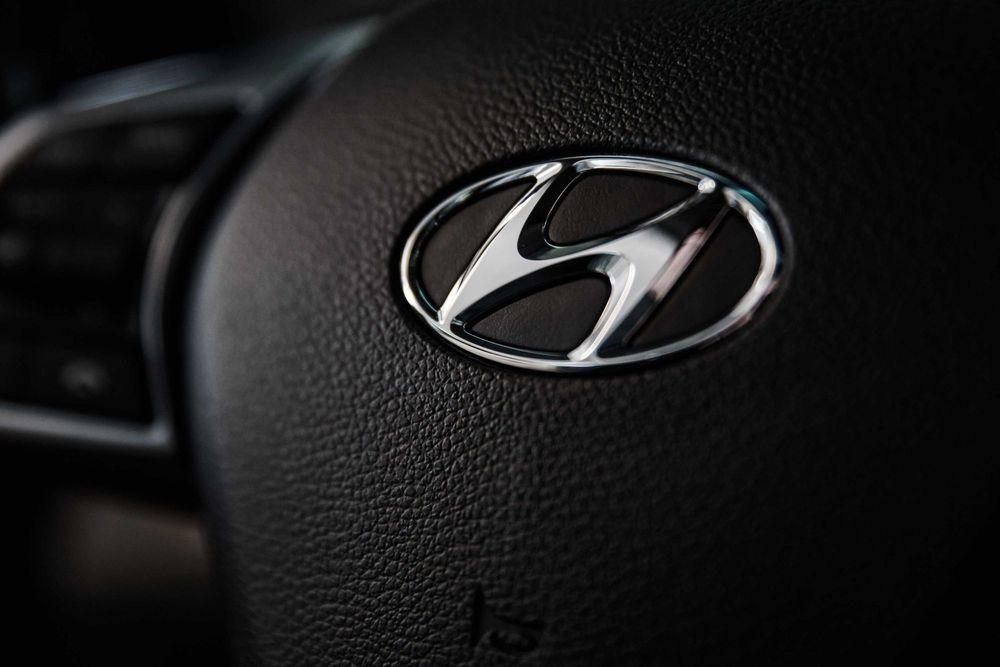 Hyundai logo on steering wheel.