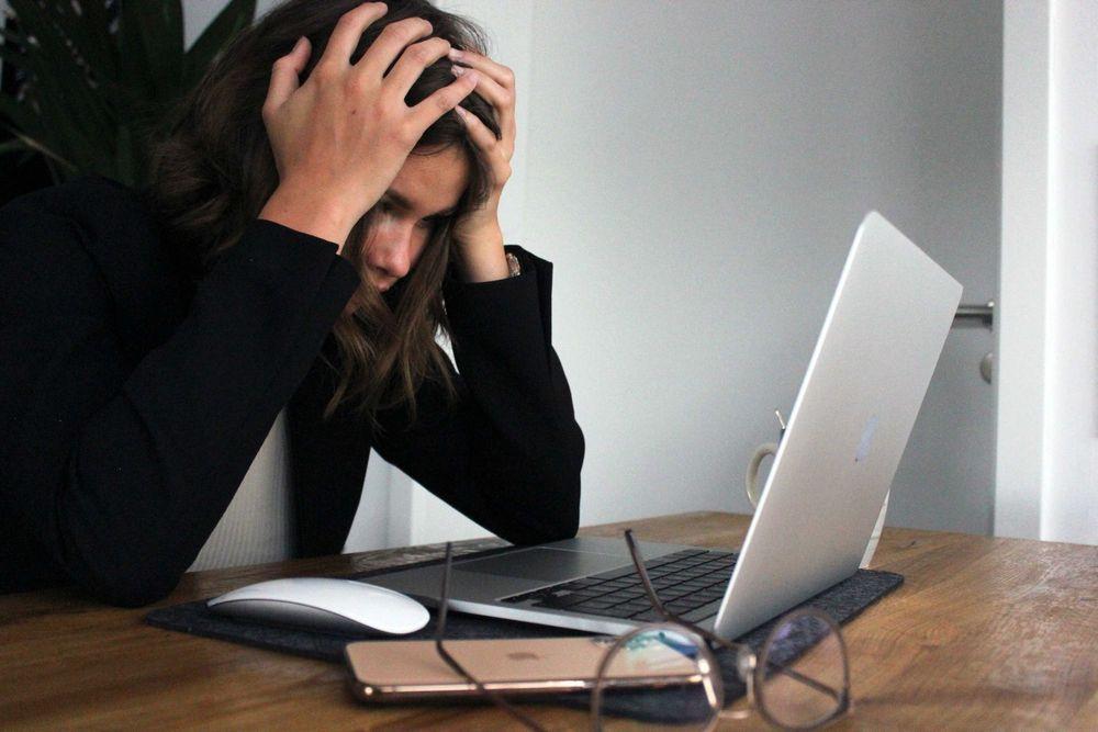 Frustrated woman on laptop