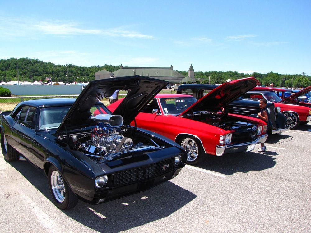 Cars lined up at car show.