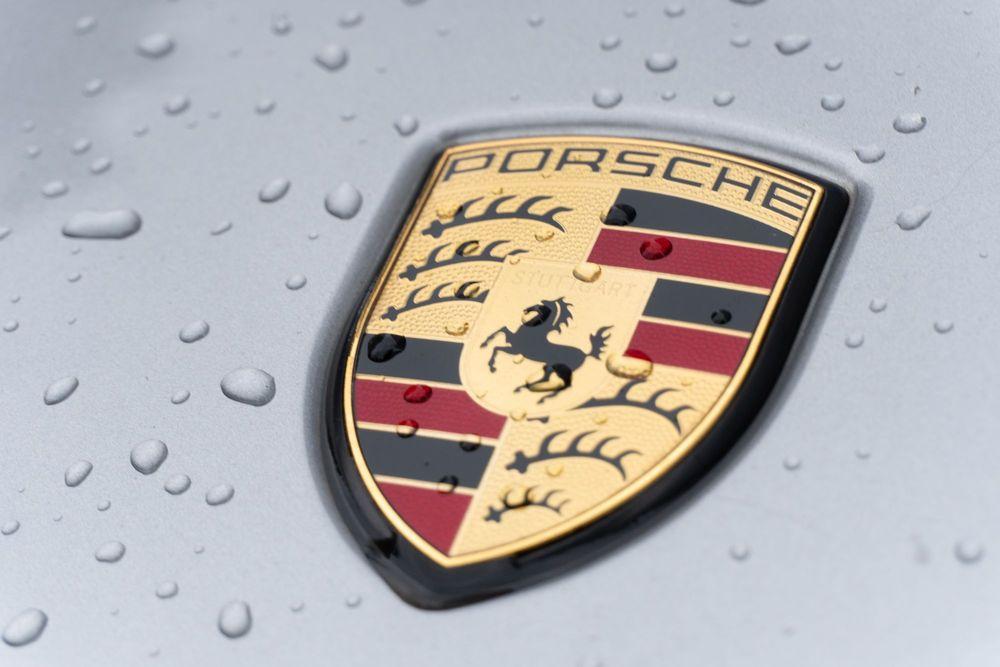 Porsche logo on silver car