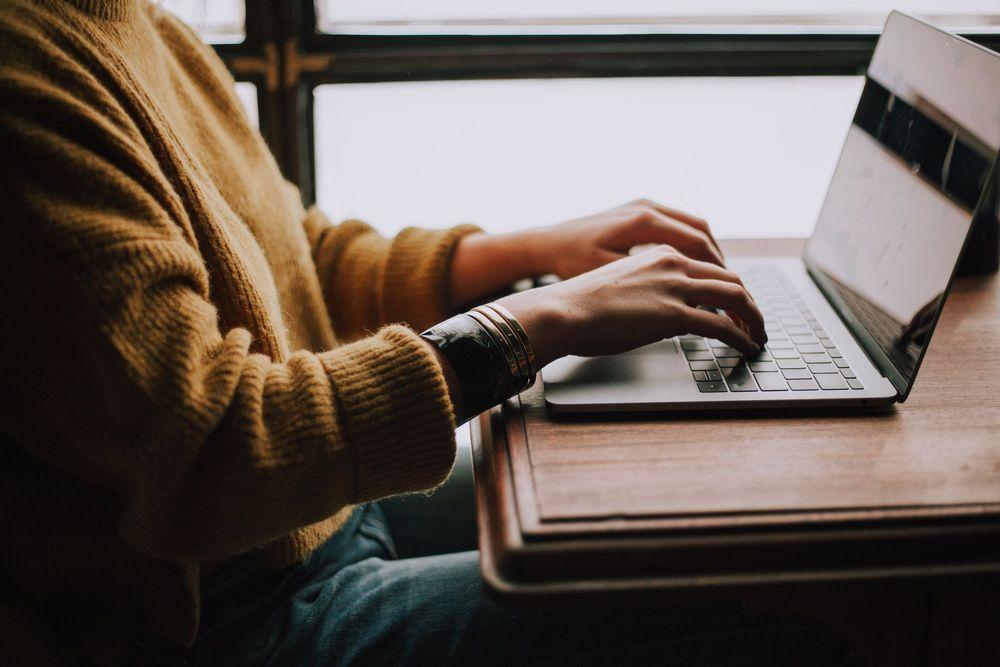 Person using their laptop.