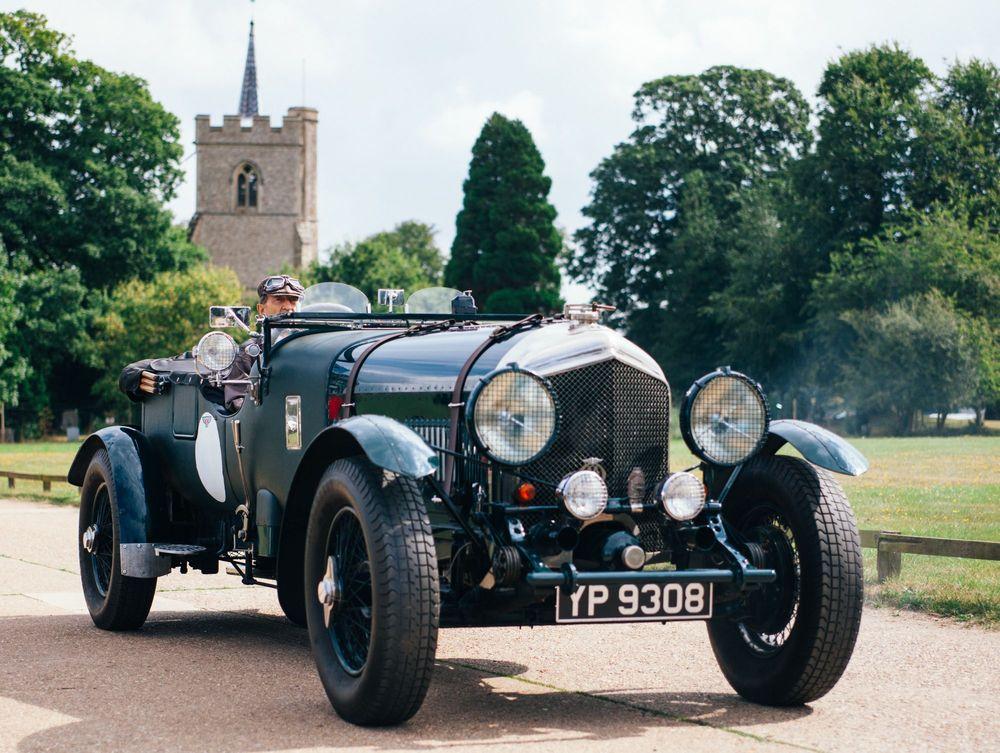 Classic roadster on concrete road.