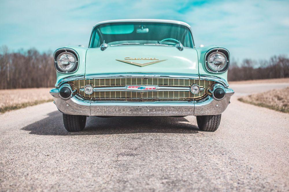 Front view of a light blue classic Chevrolet 