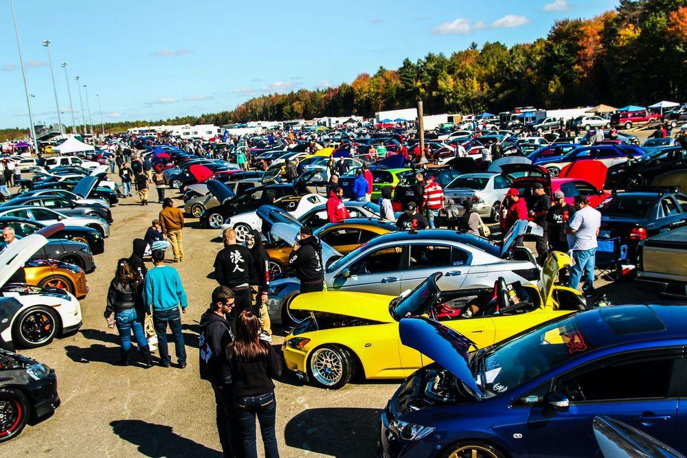 Cars and people at local car show.