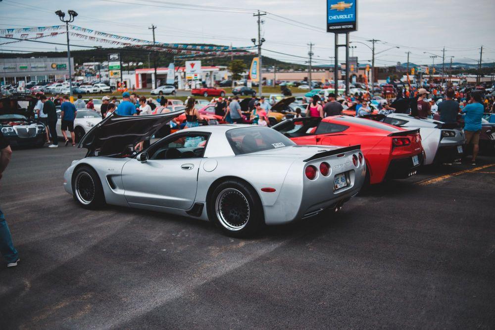 Cars and people at car show.