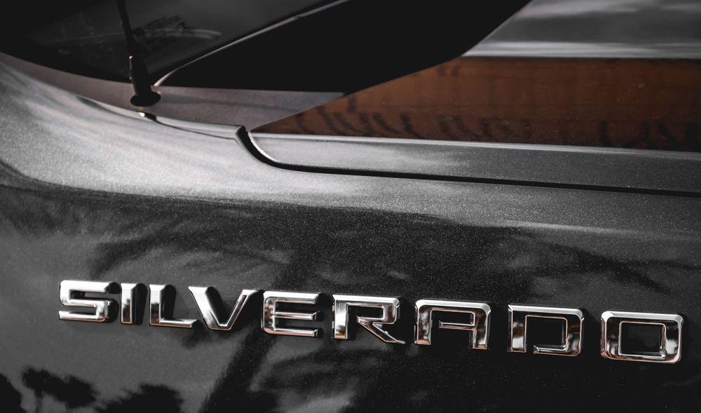 Silverado emblem on the side of a silver truck