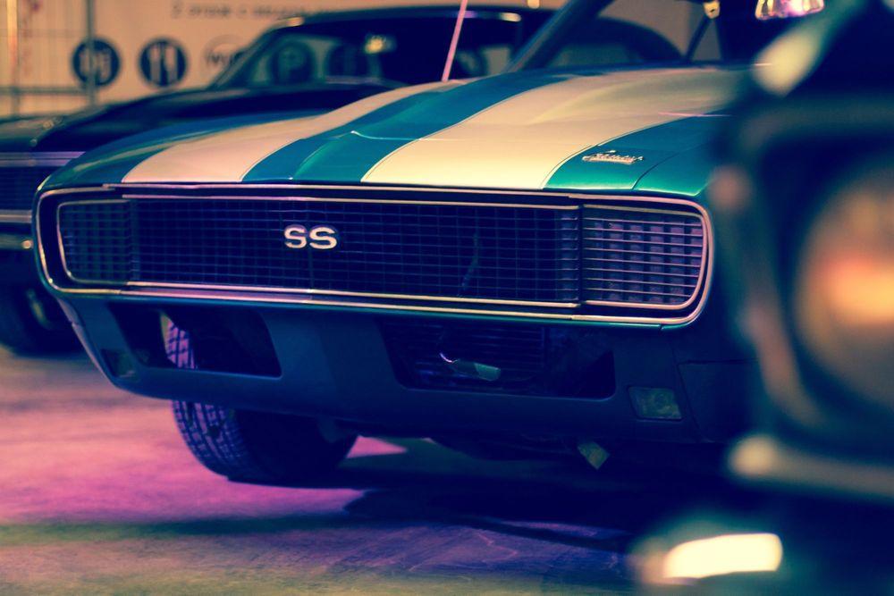 Front end of a Vintage Chevrolet Camaro SS with racing stripes