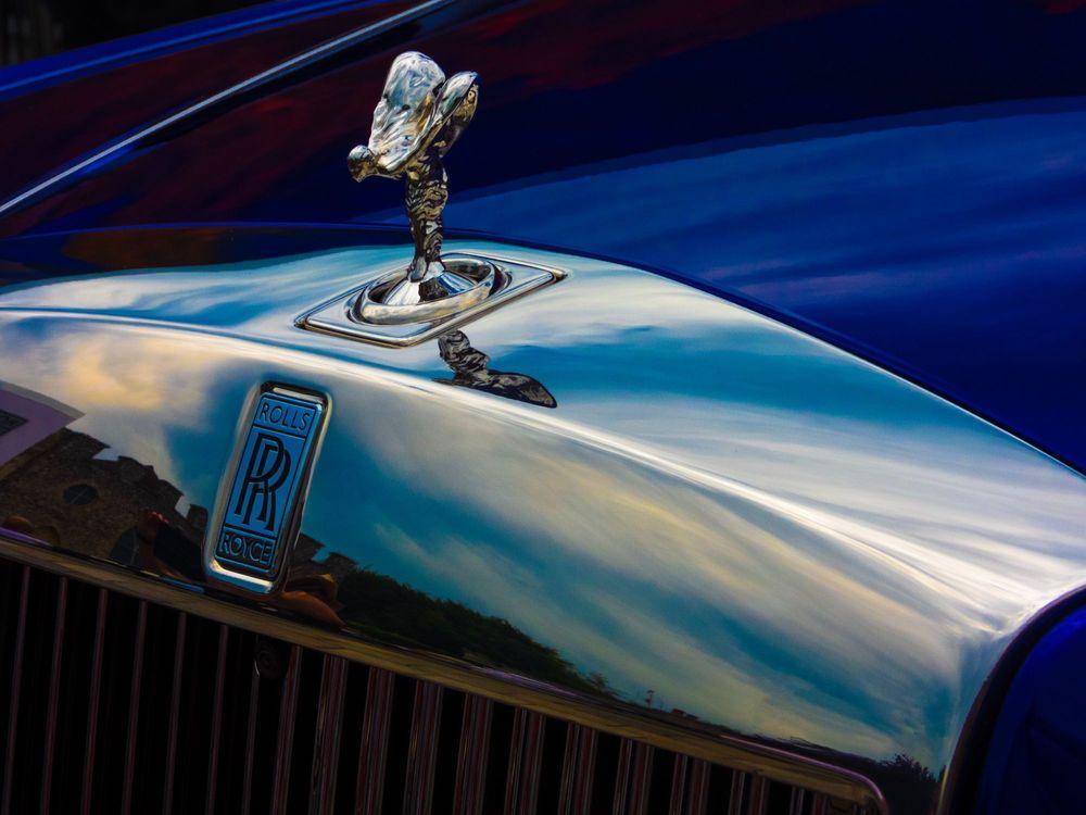 Rolls Royce emblem and logo on blue car