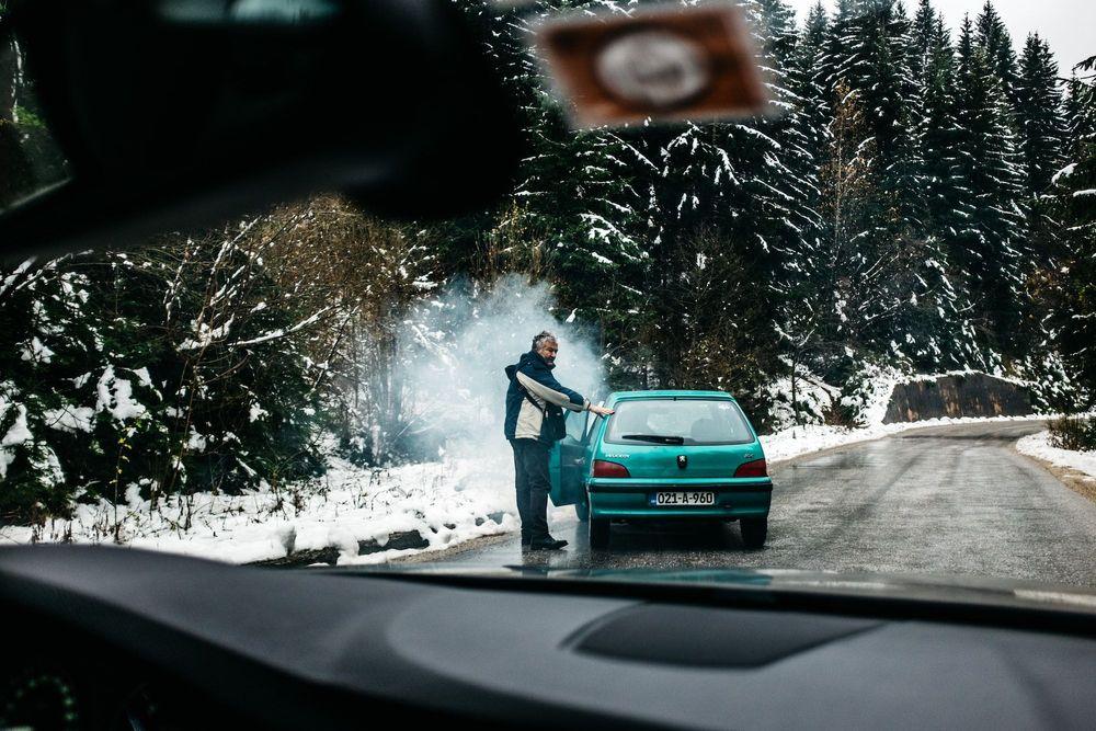 Broken down car on the side of the road