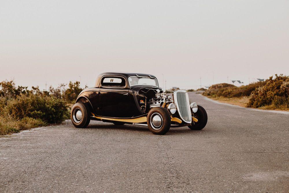 Black vintage car on asphalt road